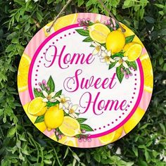 a sign that says home sweet home with lemons on it