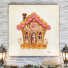 a gingerbread house is on display in front of a brick wall with two lamps