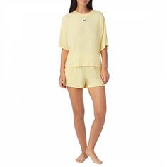 Relaxed fit round neck pyjama top with logo detailing.The boxer pyjama shorts finished with an elastic waist with logo detailing and two side pockets.Colour: YellowComposition: 61% RAYON 31% POLYAMIDE 8% SPANDEX Sleepover Party, Pyjama Set