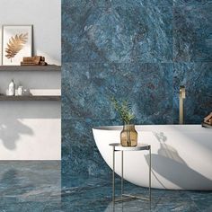 a bathroom with blue marble walls and flooring