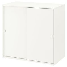 a white cabinet with two doors on one side and an open door on the other