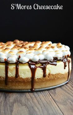 a cake with marshmallows and chocolate drizzled on the top