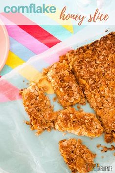 a close up of food on a plate with the words cornflake honey slice