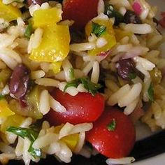 a white plate topped with rice and vegetables