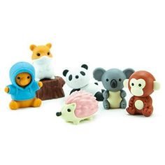 small toy animals sitting on top of a white surface next to each other in different colors