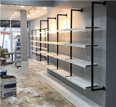 an empty store with shelves and boxes on the floor