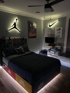 a bed room with a neatly made bed and lights