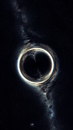 a black hole is shown in the sky with stars around it and an object that looks like a ring