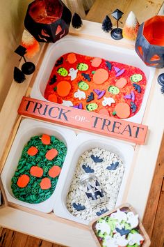 the trick or treat trays are decorated with buttons and sprinkles for halloween