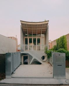 a building with a spiral staircase in front of it