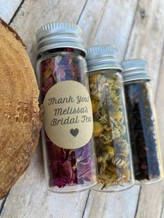 three jars filled with different types of herbs