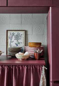 bowls and plates are sitting on the counter