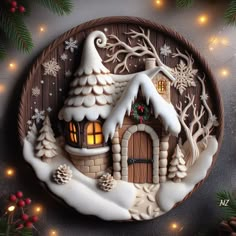 a christmas scene with a house on a plate