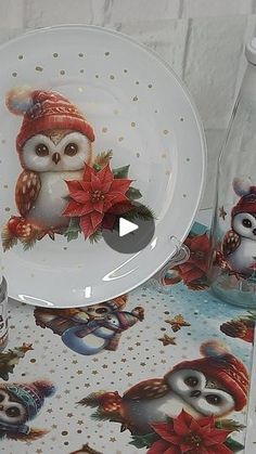 an owl themed dinnerware set on a white tablecloth with red poinsettis