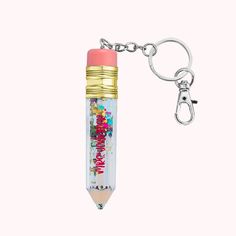 a pencil shaped keychain with the words happy birthday written on it