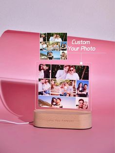 a pink photo holder with photos on it