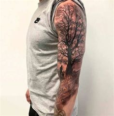 a man with a tree tattoo on his arm