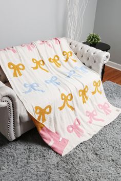 The coziest blanket for the season.Size : 50" X 60" Material : 100% Poly. Microfiber Care: Machine Wash - Cold, Do Not Bleach, Lay Flat To Dry, Do Not Iron, Do Not Dry Clean Bow Pattern Reversible Throw Blanket Ribbon Blanket, Gift Card Displays, Storing Blankets, Cozy Throw Blanket, Blanket Black, Bow Print, Bow Pattern, Gift Bows, Blankets For Sale