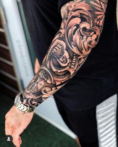 a man with a tattoo on his arm