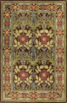 a rug with an ornate design on the bottom and sides, in brown tones is shown