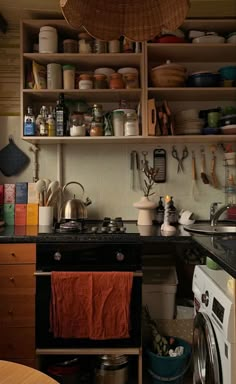 the kitchen is cluttered with pots and pans, dishes, and utensils