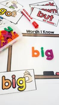 the word big is placed on top of some cards with letters and words in them