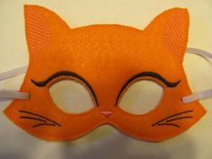 an orange cat mask with black eyes