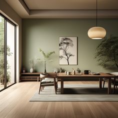 a dining room with wood floors and green walls, an art work hangs on the wall