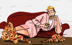 a man sitting on a couch with pizza slices around him and his legs spread out