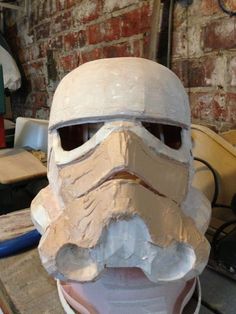 a helmet that is made to look like the force awaker from star wars sitting on top of a table