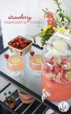 strawberry margarita punch with fresh strawberries and flowers