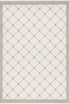 a white rug with grey trimmings on it