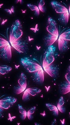 many pink butterflies are flying in the air with blue and purple lights around them on a black background