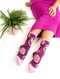 Bold oversized pomegranates, figs, and grapes juxtaposed with zebra stripes is a modern take on the 1980s. The playful pink and purple color combination adds a quirky touch to your look. Made from mercerized cotton for an extra soft feel. Shop more fabulously fun socks from Sock Candy here! One Size. Recommended fit US W5.5-10 (can stretch to fit up to size 11). 200 Needle Count. 60% Mercerized Cotton, 37% Nylon, 3% Lycra Machine wash cold inside out with like colors. Hang dry or tumble dry low. 80s Socks, Fruit Socks, Purple Color Combinations, Fancy Socks, 80s Shoes, Heart Lingerie, Dita Von Teese Lingerie, Plus Size Tights, Shoes And Socks