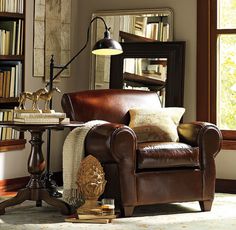 a living room filled with furniture and a lamp