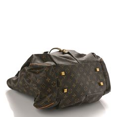 This is an authentic LOUIS VUITTON Monogram Irene. This handbag is crafted of traditional monogram toile dark brown canvas in a pleated fashion, trimmed with natural vachetta cowhide flat leather straps and polished gold hardware. A metallic leather trim, tassel, and drawstring pull accent the exterior. This spacious bag is open to a partitioned black microfiber interior with a large zippered compartment and a patch pocket. The bag can be cinched closed with the draw-string and is protected by four-studded feet. Traditional Monogram, Pleated Fashion, Brown Canvas, Metallic Leather, Authentic Louis Vuitton, Leather Trim, Leather Trims, Gold Hardware, Louis Vuitton Monogram