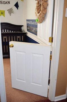 an open door to a baby's room with a crib in the background