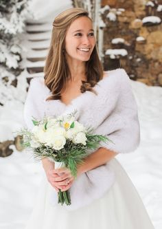 a woman in a wedding dress holding a bouquet