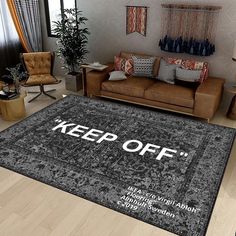 a living room with a rug that says keep off