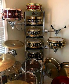 there are many different types of drums in this room, including one that is stacked on top of the other