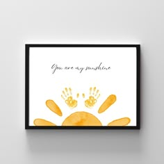 an art print with the words you are my sunshine written on it and two hand prints