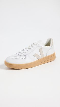 Upper: CalfskinSuede trimLining is made from cotton and recycled plastic bottlesSole made of Amazon rubber, rice waste, and recycled rubberLace-up closureRound toeRubber soleImported, BrazilThis item cannot be gift-boxedStyle #VEJAA30690 Veja V 10, Veja Shoes, Veja Sneakers, Recycled Rubber, Recycle Plastic Bottles, Recycled Plastic, Plastic Bottles, Calf Skin, Rubber Sole