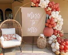 a couple of chairs sitting on top of a patio next to a sign that reads miss to mrs