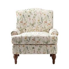 an upholstered chair with floral fabric and wooden legs, against a white background