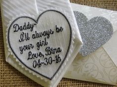 two embroidered hearts are next to an envelope with the words daddy and i'll always be your girl