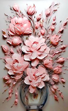 a vase filled with pink flowers sitting on top of a table next to a wall