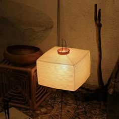 a lamp sitting on top of a wooden table