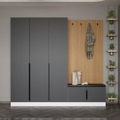 a living room with grey cupboards and plants