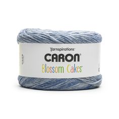 yarn that is blue and white with the words carbon blossom cakes on it in front of a