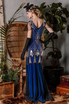 Feel like creating an atmosphere, darling? This stunning 1920s-style frock from Retro Stage is a gorgeous deco affair in fabulous flapper design. The cap sleeves and V-neck design shows you off with a modest touch. An elegant 1920s dress in a lightweight black mesh with a subtle blue & red lining that creates a sweetheart bodice. Available in sizes S-XL while supplies last. 
Color: Dark Blue, Rose Red Material: Polyester, Spandex Dresses Length: Full Length Stretch: Little Stretch Zipper: Si Fitted Blue Flapper Dress, Flapper Girl Dress, Gatsby Birthday, 20s Fashion Dresses, Style Année 20, 1920s Fashion Dresses, Retro Stage, Robes Vintage, Marine Uniform